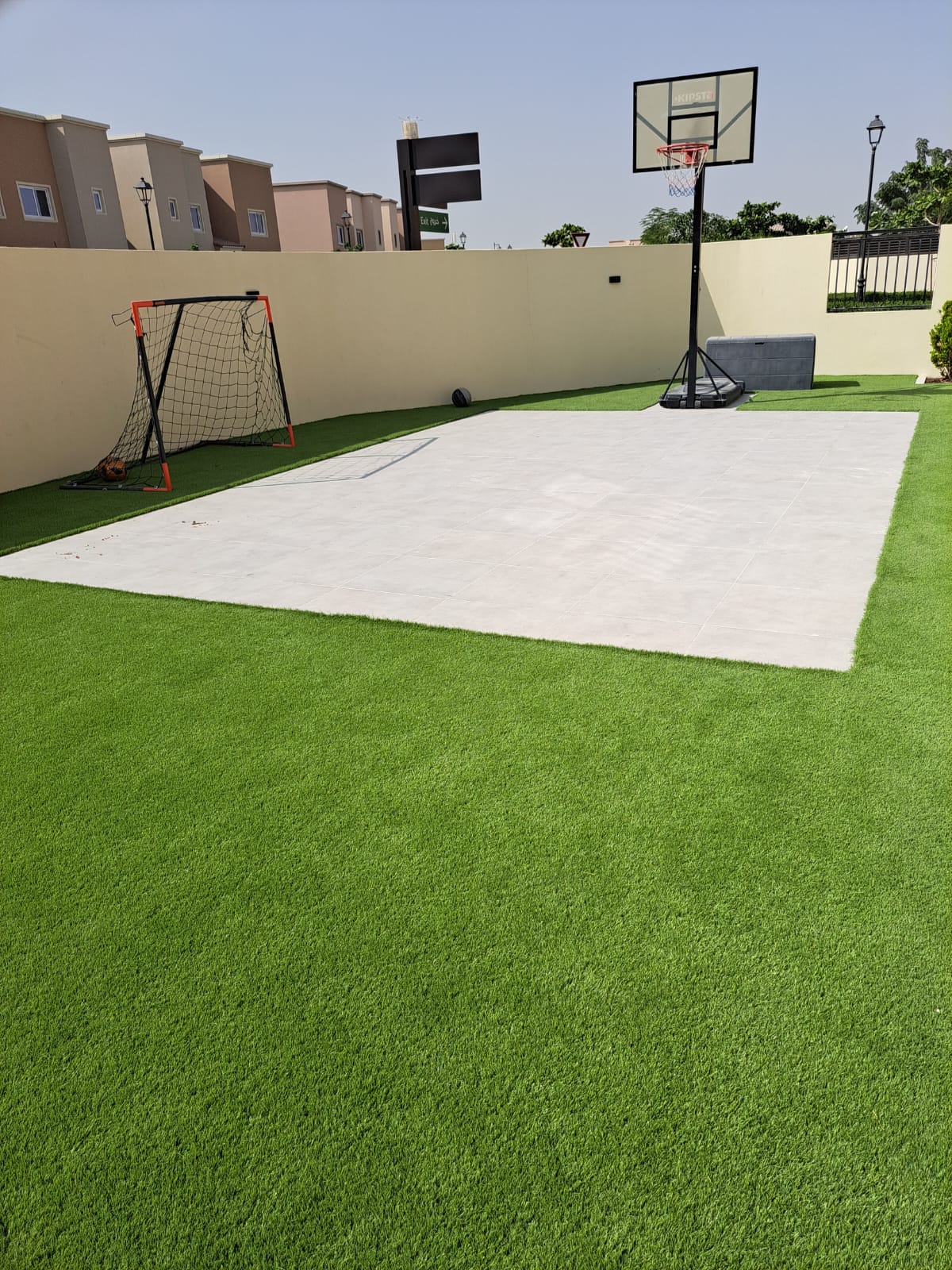 Backyard sports court & lawn — Reem Mira townhouse
