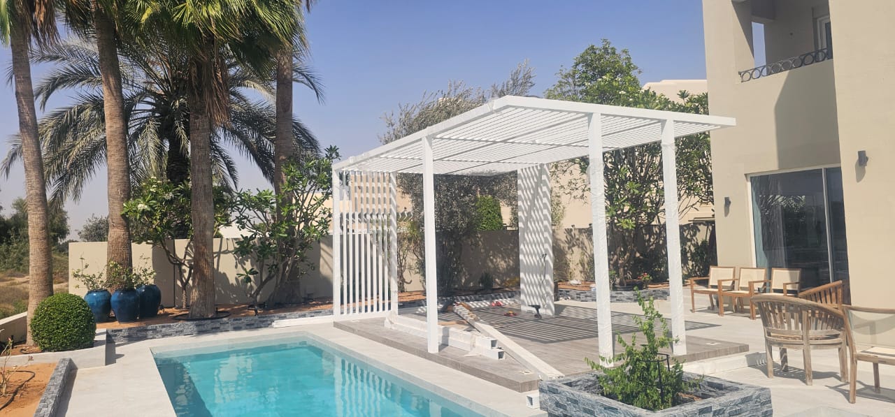 White poolside pergola — Arabian Ranches pool deck, outdoor living project by Blue Iconic