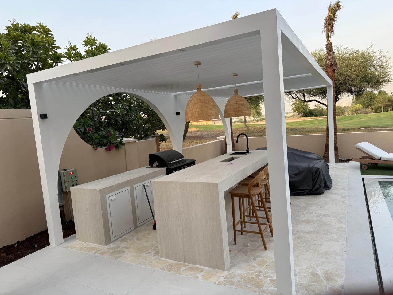 Poolside outdoor kitchen & bar — Emirates Hills golf frontage, outdoor living project by Blue Iconic