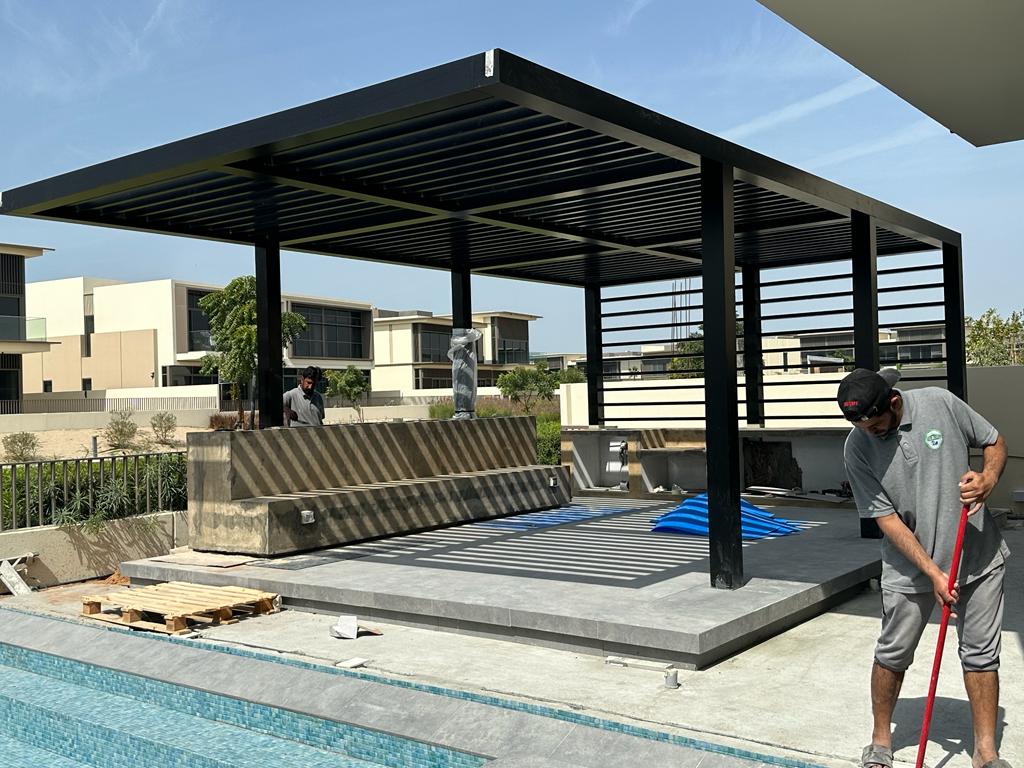Poolside louvre installation — Dubai Hills Grove villa