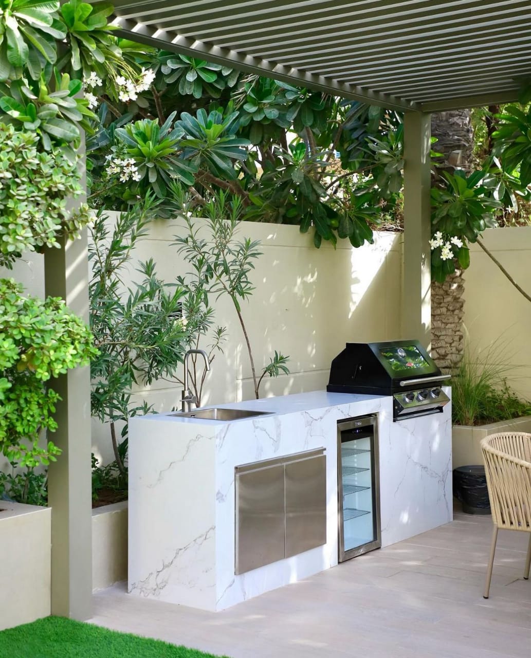Marble outdoor kitchen island — Al Barari garden