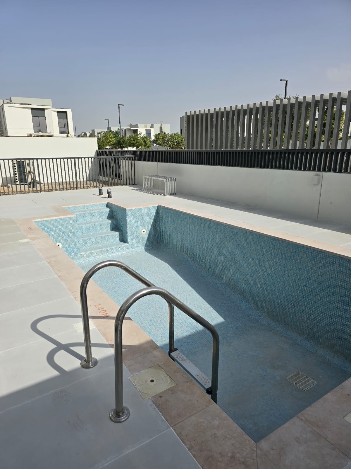 Pool deck and landscaped surroundings built by Blue Iconic in Dubai